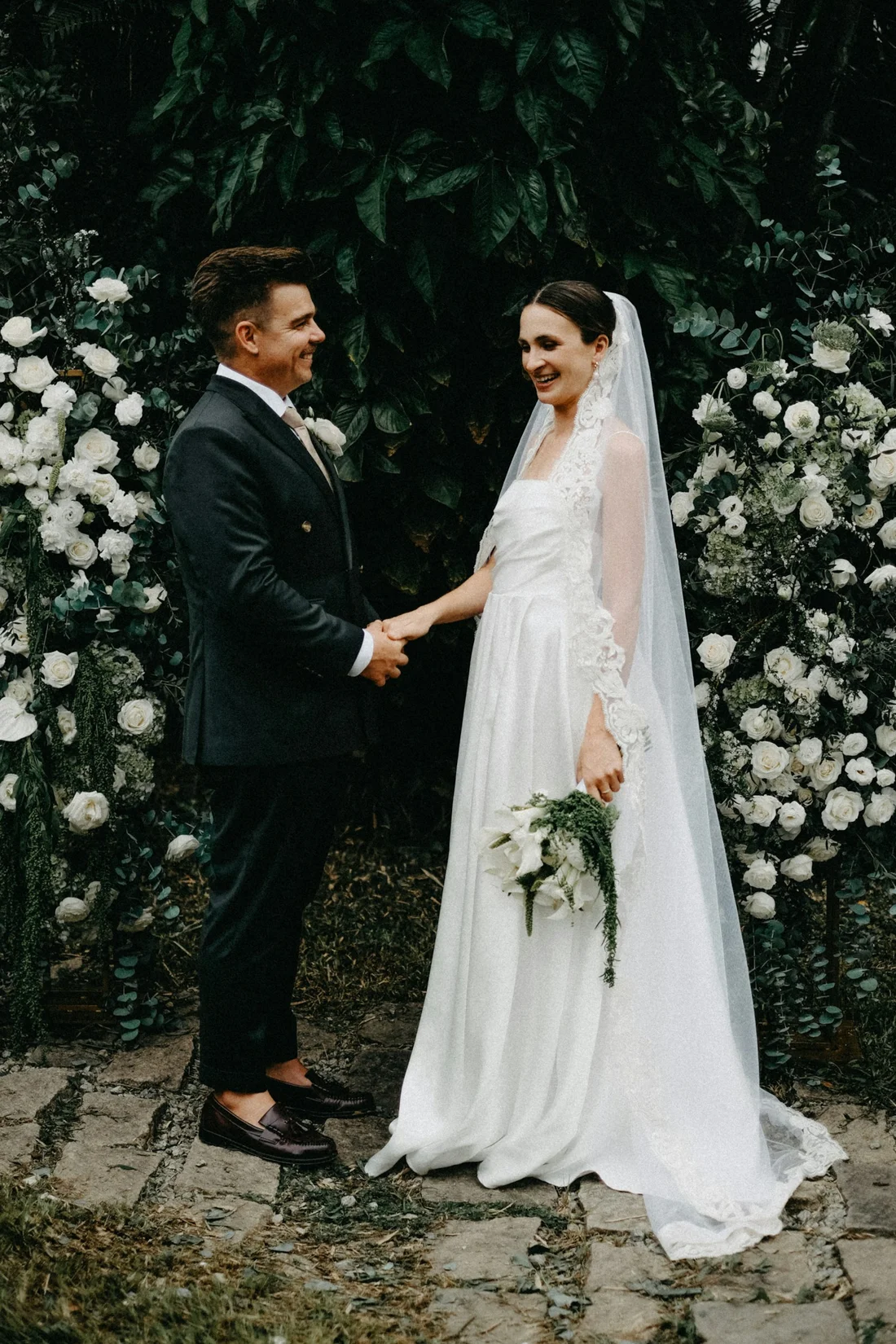 Detail of the wedding dress and joined hands